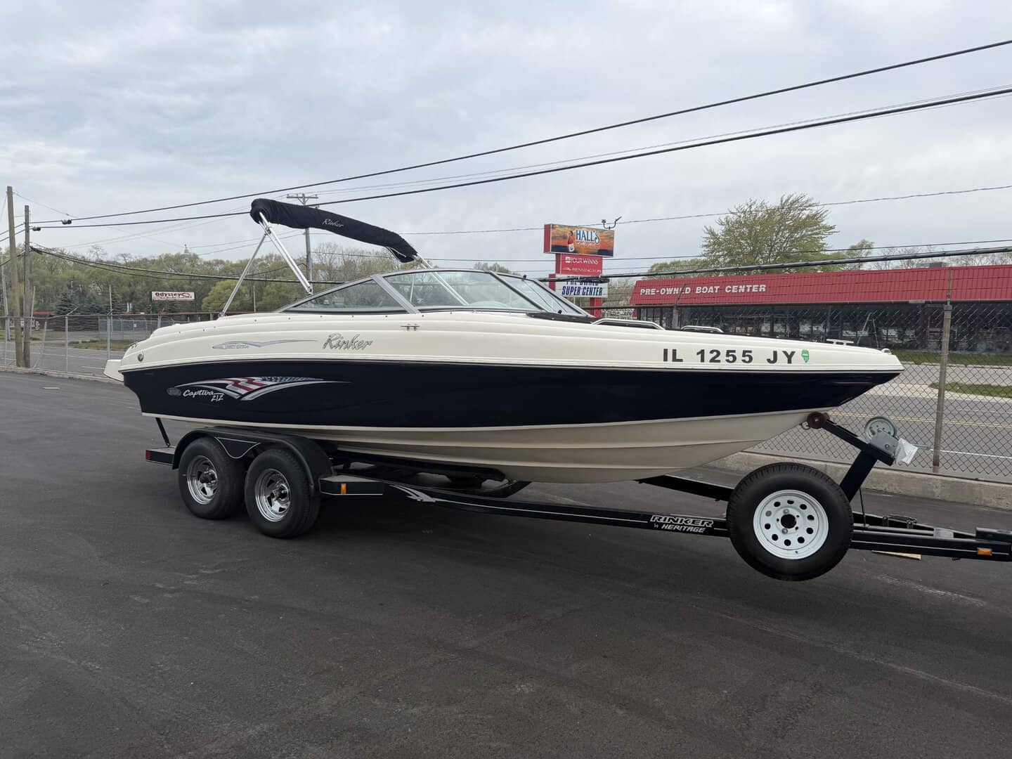 Speedboat on trailer parked outside Hall's Sport Center in Illinois.