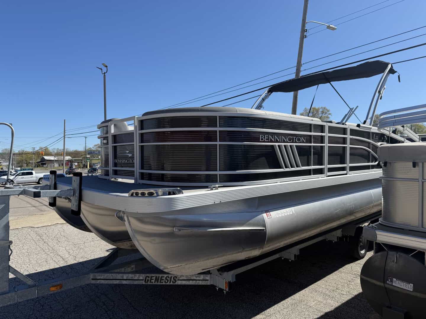Bennington pontoon boat displayed at Hall's Sport Center for sale or rent.